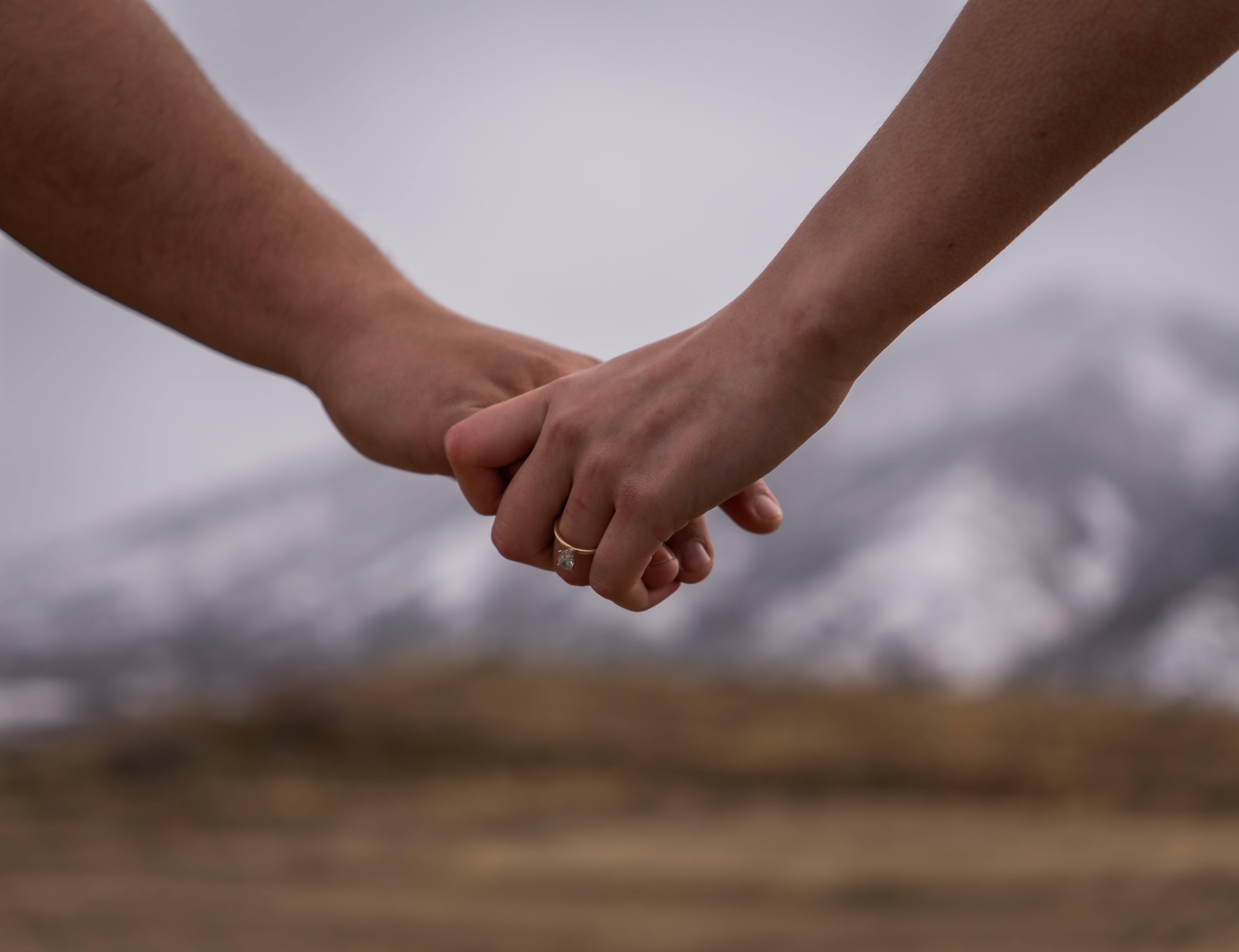 Kaylee and Adrien Holding Hands